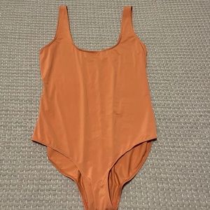 Orange comfy bodysuit